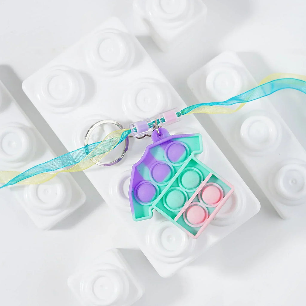 ilearnngrow PopIt Rakhi multiple shapes - Naivri